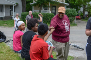Ken Weathersby, right, Southern Baptist Convention Executive Committee vice president for convention advancement, witnesses to local youth attending a block party June 13 at North Linden Baptist Church in Columbus, Ohio. The event was part of Crossover 2015, a series of evangelistic events held prior to the two-day Southern Baptist Convention annual meeting June 16-17 at the Greater Columbus Convention Center. - Photo by Paul W. Lee