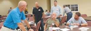 John Tallman, left, of Fort Sherman Academy visits during a break of the conference with, from left, Al Nickel of Thompson’s Station Baptist Church, Thompsons Station; Ron Wilson of Magna View Baptist Church, Talbott, who also is a Jefferson County deputy sheriff; Scott Johnson, pastor, Lantana Road Baptist Church, Crossville; and David Carothers, pastor of missions and discipleship, First Baptist Church, Jackson.
