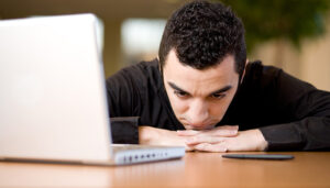 man-head-on-desk